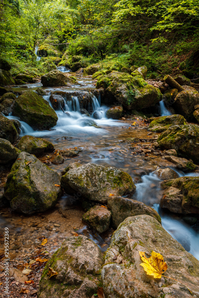 Waterfall in Autumn forest. Beautiful nature background from austria Waterfall in Autumn forest. Beautiful nature background from austria