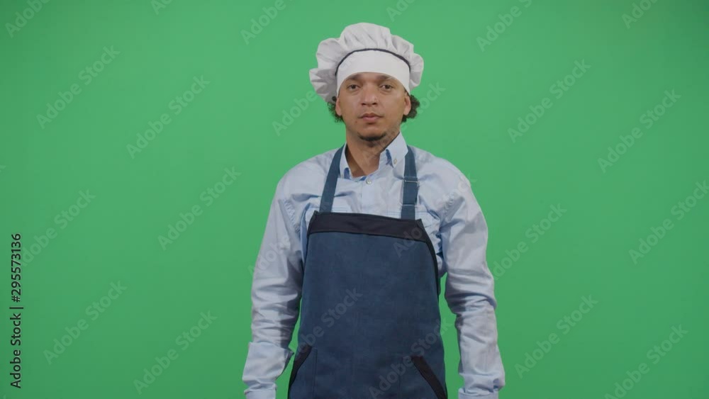 Kung Fu Adult Man Cook Fighting With The Dark Spirit Of The Kitchen. Studio Isolated Shot Against Green Screen Background Kung Fu Adult Man Cook Fighting With The Dark Spirit Of The Kitchen. Studio Isolated Shot Against Green Screen Background
