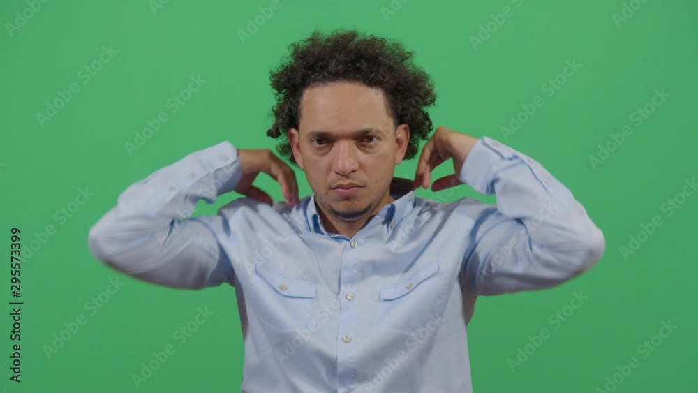 Adult Man Running Hands Through His Hair. Studio Isolated Shot Against Green Screen Background Adult Man Running Hands Through His Hair. Studio Isolated Shot Against Green Screen Background