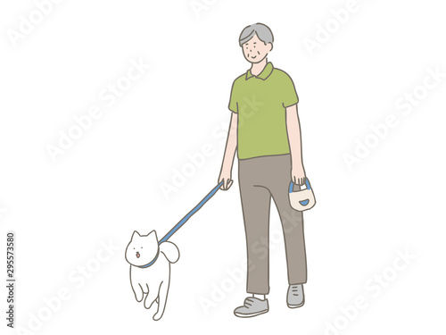 散歩する犬と中年男性