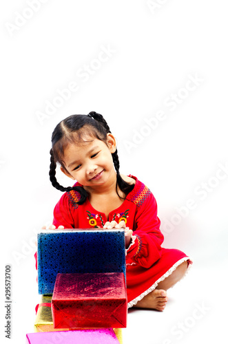 Cute asian baby girl to funny with play giftbox stack on white backgrounds