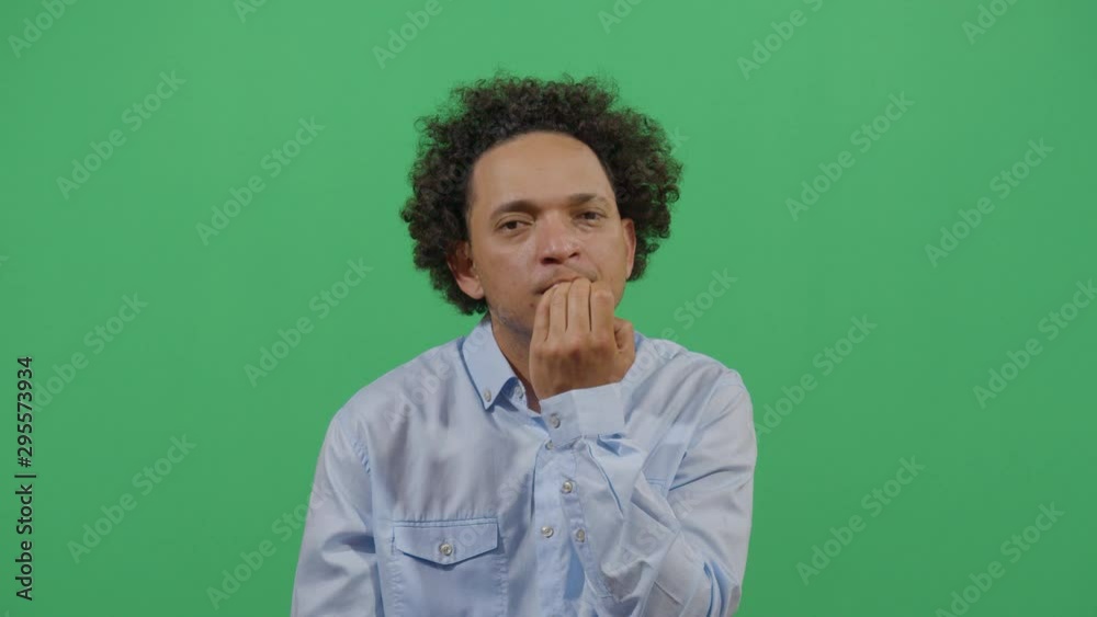 Nails Biting By An Adult Man Ugly Habit Expressed In Front Of The Viewer. Studio Isolated Shot Against Green Screen Background Nails Biting By An Adult Man Ugly Habit Expressed In Front Of The Viewer. Studio Isolated Shot Against Green Screen Background