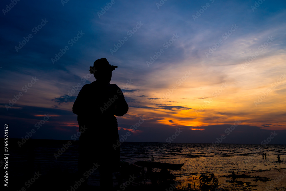 silhouette of man at sunset