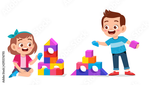 happy cute kids play brick block together