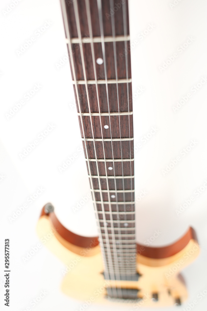Obraz premium Classic shape wooden electric guitar with rosewood neck