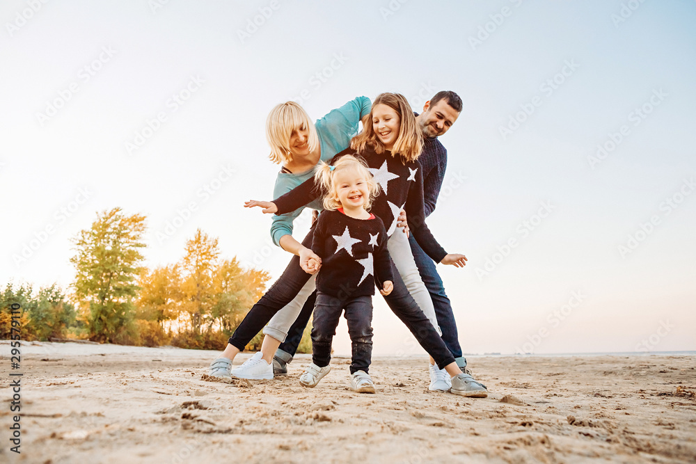 Happy family having fun by the river Happy family having fun by the river