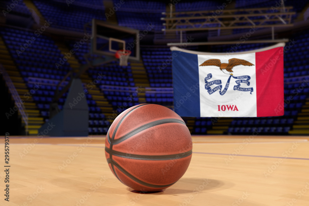 Naklejka premium Iowa state flag and basketball on Court Floor