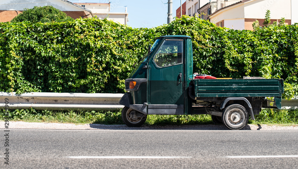 Typical italian farm ape truck on three wheels.