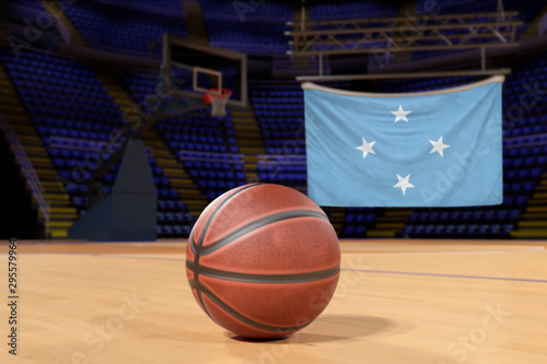 Micronesia flag and basketball on Court Floor © Derek Brumby