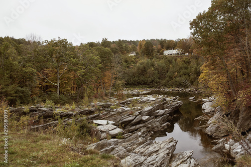 Fall Foliage surrounding stream in the New England town of Quechee, Vermont