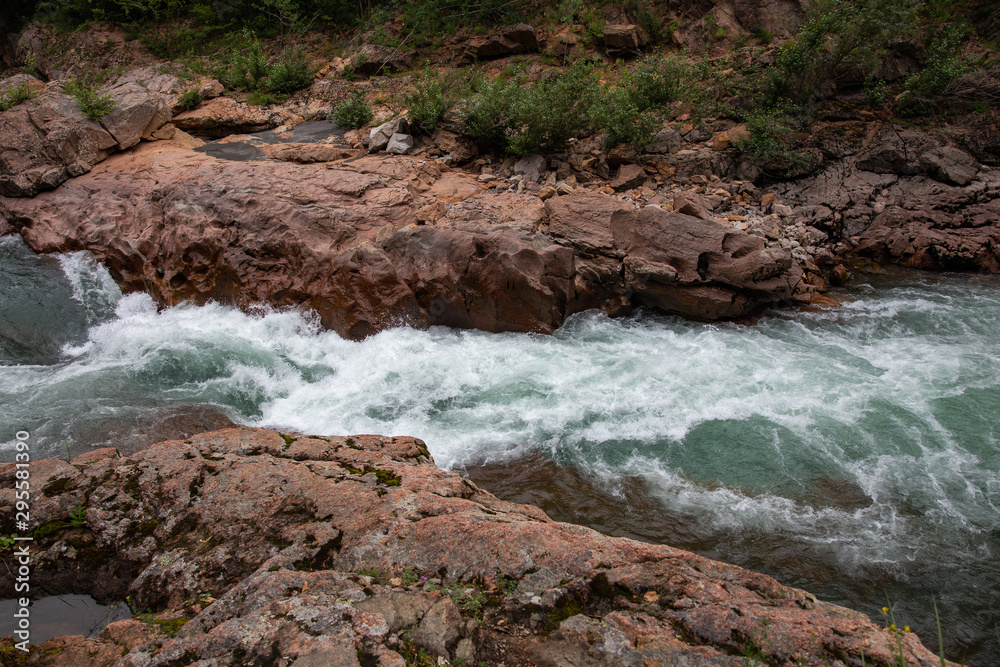 Naklejka premium Beautiful stormy river with blue water in granite canyon, Russia, Republic of Adygea