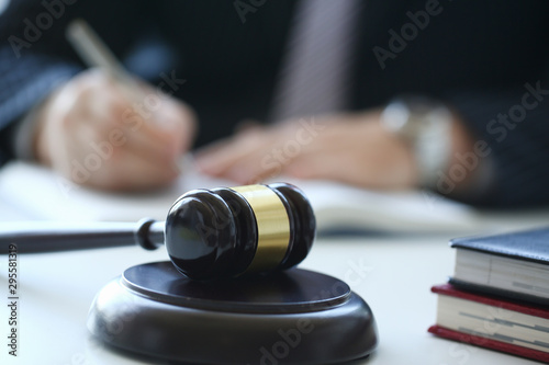 The judge hammer lies on table in debate room for fair judgments economic notions of violations legal system fraud and punishment