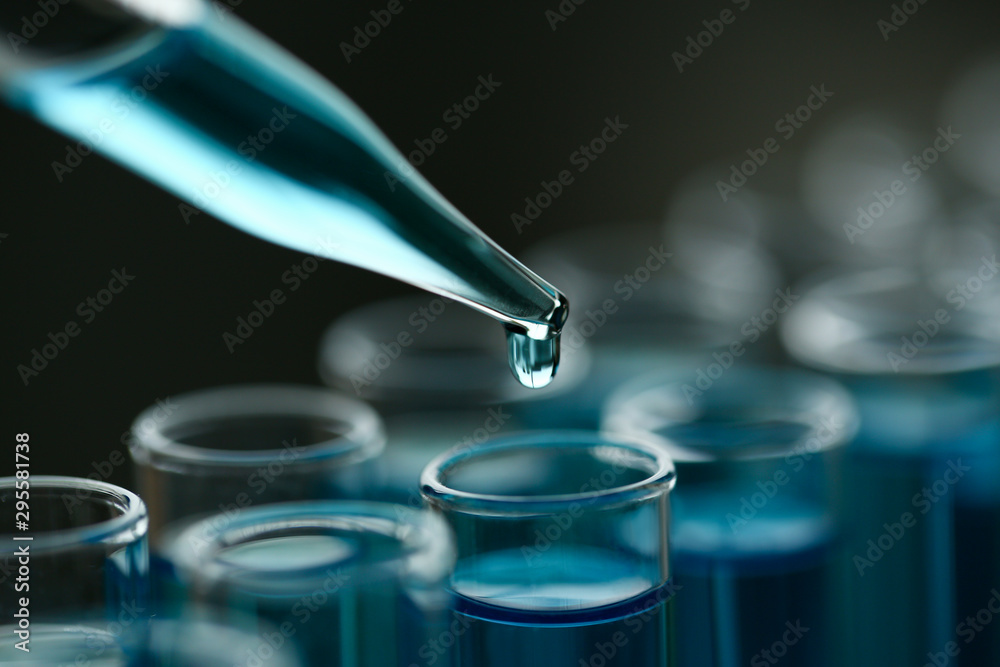 Test tube of glass overflows new liquid solution potassium blue conducts an analysis reaction takes various versions reagents using chemical pharmaceutics cancer manufacturing . - obrazy, fototapety, plakaty 