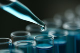Test tube of glass overflows new liquid solution potassium blue conducts an analysis reaction takes various versions reagents using chemical pharmaceutics cancer manufacturing .