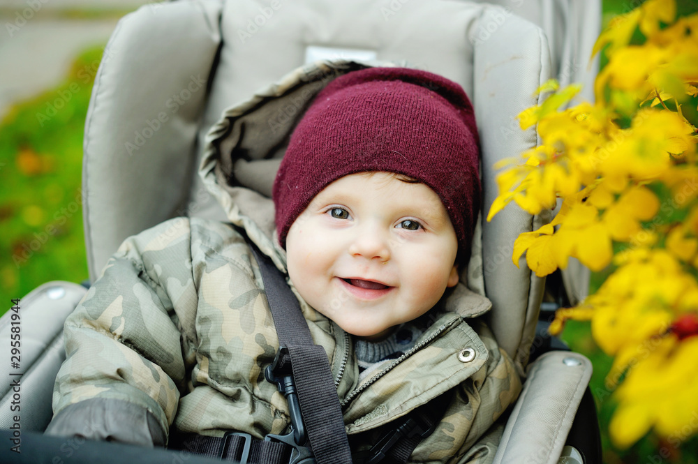 Baby boy in warm in modern stroller Baby boy in warm in modern stroller