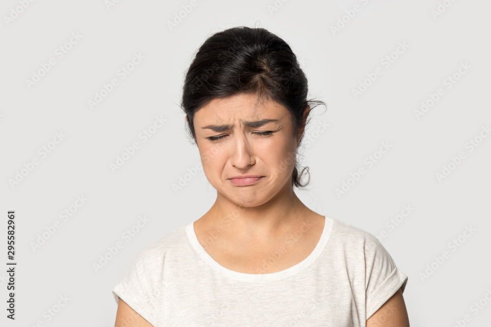 Sad ethnic girl crying suffering from depression Sad ethnic girl crying suffering from depression