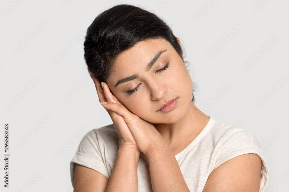 Tired indian girl fall asleep head on hands Tired indian girl fall asleep head on hands