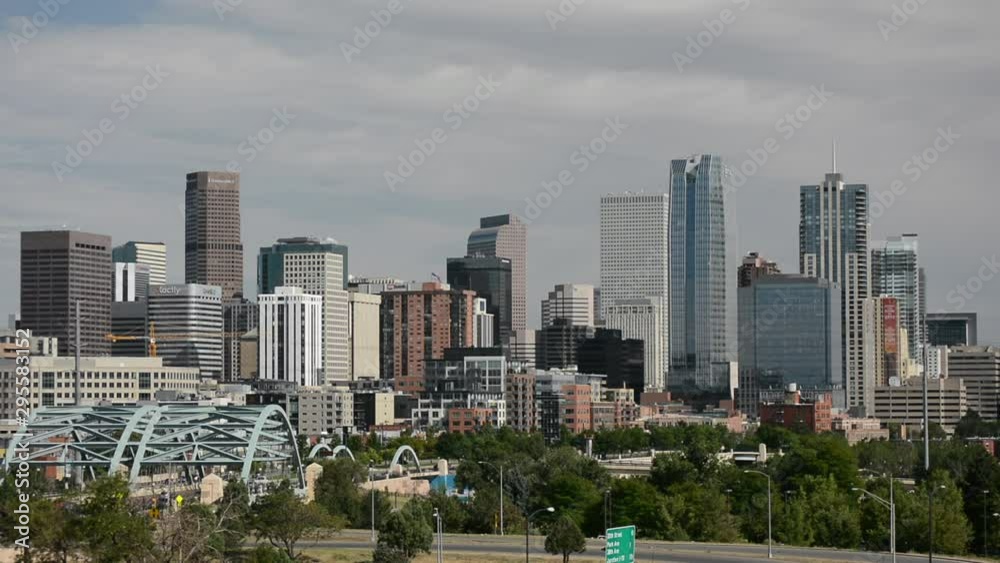 Downtown Denver, Colorado Skyscrapers with Confluence Park and the Speer Blvd. Platte River Bridges in the Foreground Downtown Denver, Colorado Skyscrapers with Confluence Park and the Speer Blvd. Platte River Bridges in the Foreground