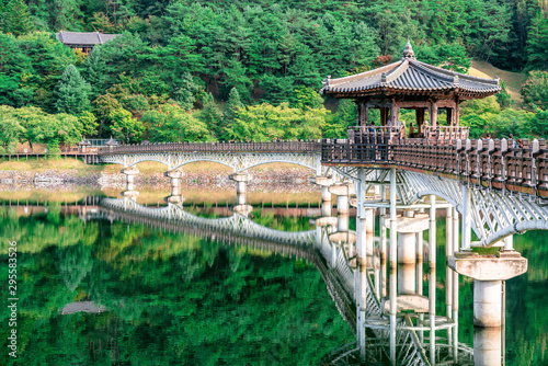 View of Weolyeonggyo bridge and pavilion with water reflection a wooden bridge spanning the Nakdong River in Andong Korea photo