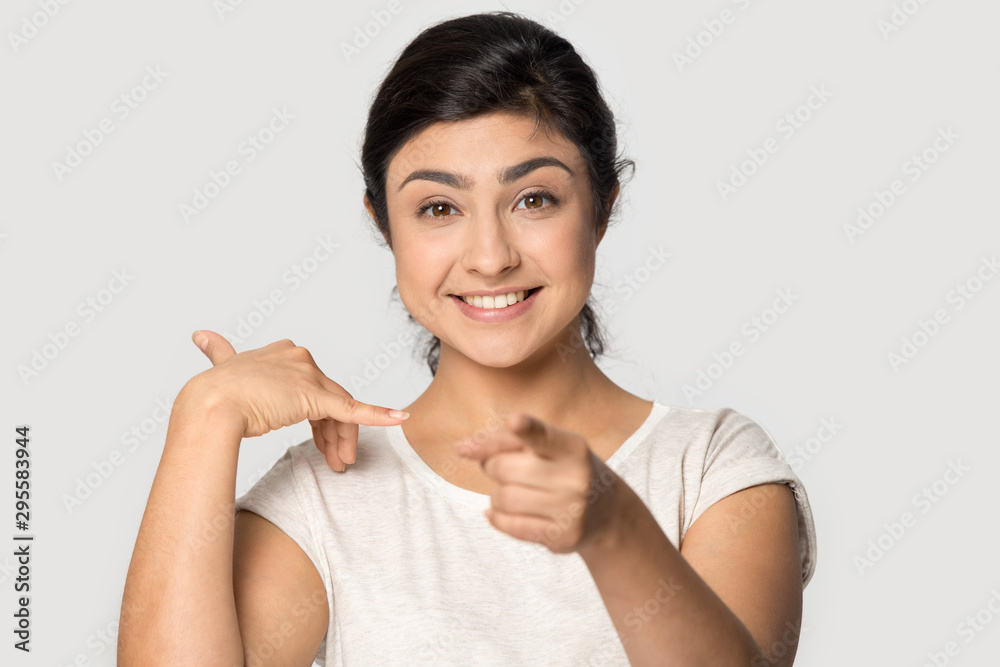 Smiling indian girl point at camera ask calling Smiling indian girl point at camera ask calling
