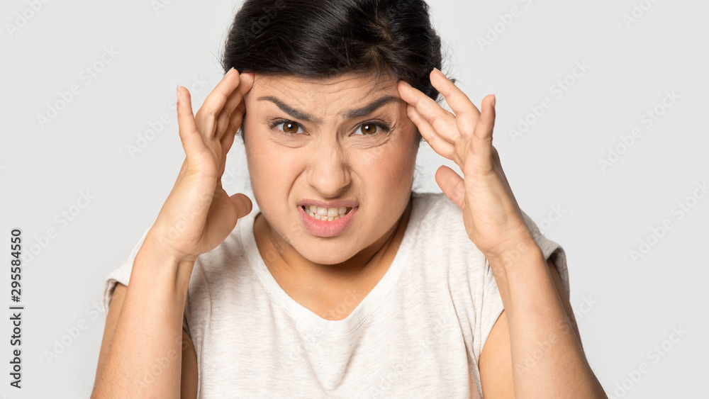 Unhealthy indian girl suffer from migraine need painkiller