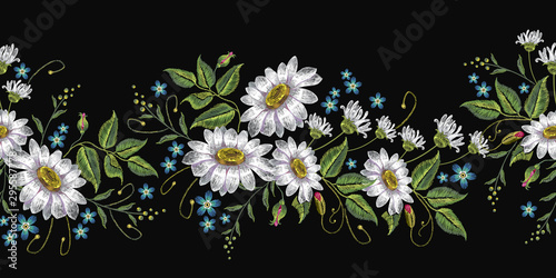 Beautiful white chamomiles horizontal seamless pattern. Embroidery on black background. Template for clothes, textiles, spring flowers