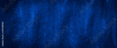 Saturated dark blue watercolor with unique uneven paint stains. Abstract indigo background for design, layouts and templates. photo