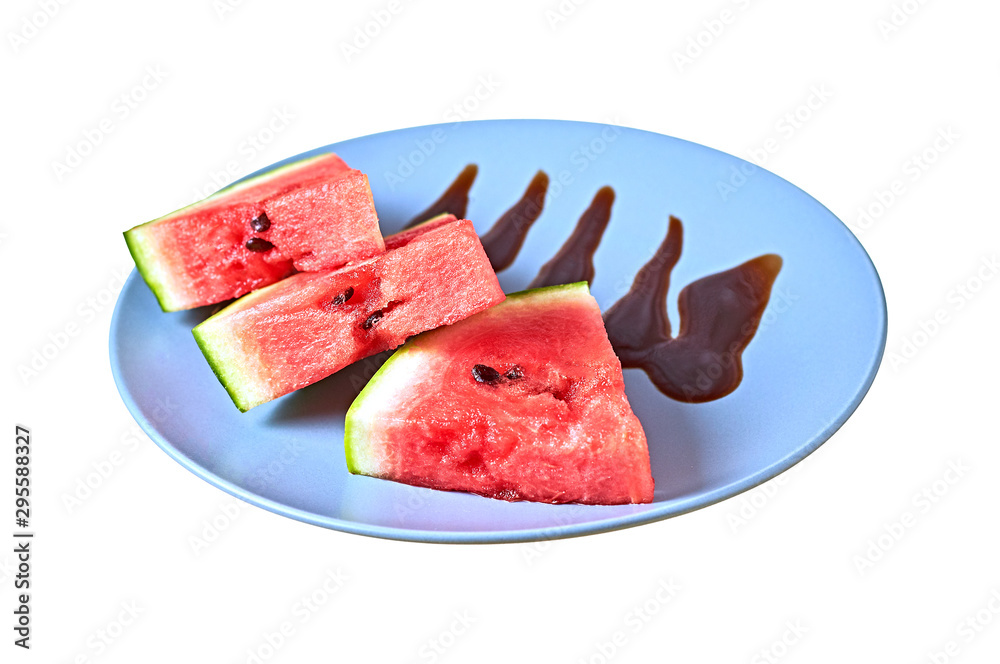 Three slices of fresh watermelon in form of triangle with red ripe juicy pulp lies on round ceramic plate decorated of melted chocolate or cream isolated on white background without shadow Three slices of fresh watermelon in form of triangle with red ripe juicy pulp lies on round ceramic plate decorated of melted chocolate or cream isolated on white background without shadow