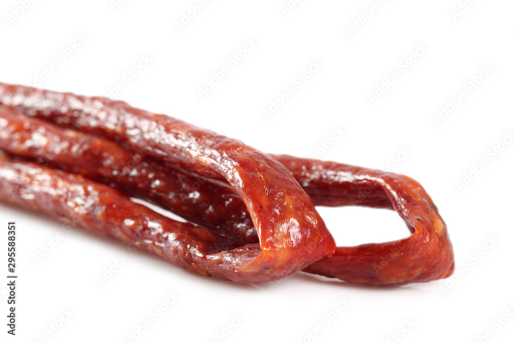 Kabanos. Polish long thin dry sausage made of pork. Isolated on white background.