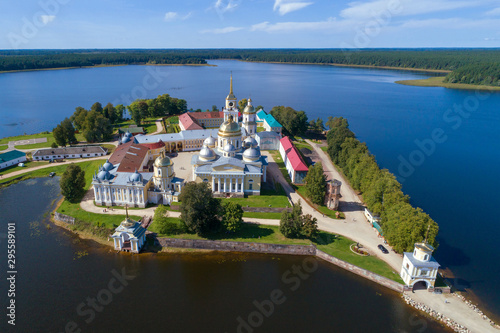 Nilo-Stolobenskaya pustyn on the background of Seliger Lake on a sunny August day (aerial photography). Tver region, Russia photo