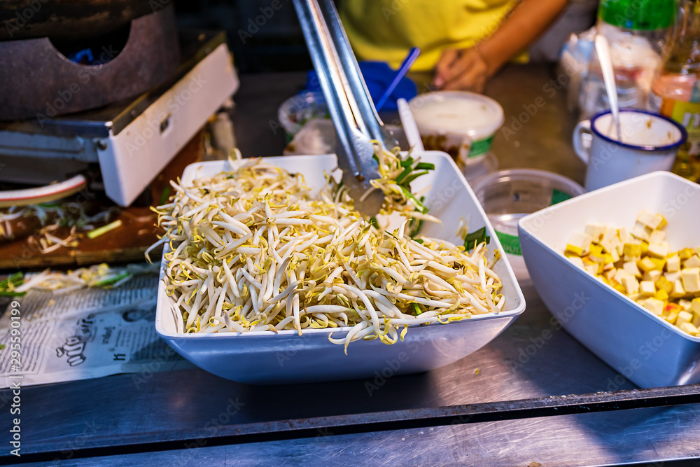 Square bowl of bean sprouts on a food cart in Bangkok
