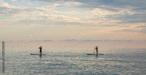 Riding the water board on the Black Sea on a hot summer day © Valentin