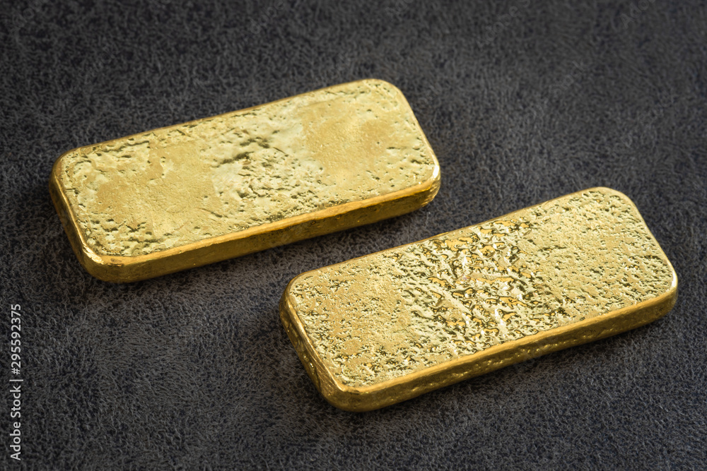 Fototapeta premium Gold bar on black leather