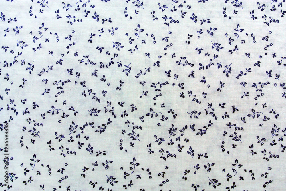 Blue plant leaves print fabric close up background. Blue plant leaves print fabric close up background.