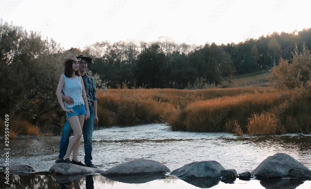 man and a girl are walking in the autumn man and a girl are walking in the autumn