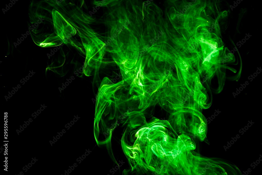 Green smoke on black background Green smoke on black background