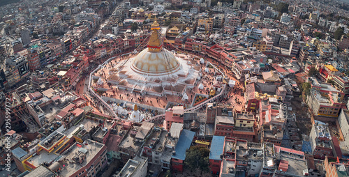 Panoramic Aerial view on streets of Kathmandu and a stupa of Boudhanath is created in the form of a Buddhist mandala. Nepal, shooting from the drone