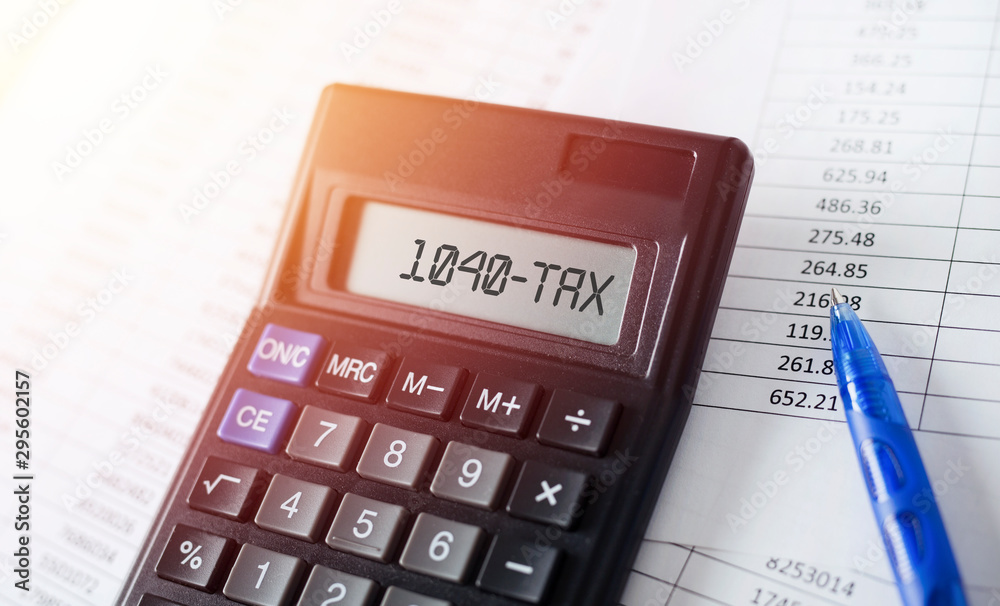 Word 1040 Tax on calculator. Business and tax concept. Word 1040 Tax on calculator. Business and tax concept.