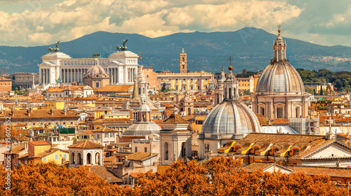 Obraz na płótnie Aerial panoramic cityscape of Rome, Italy, Europe. Roma is the capital of Italy. Cityscape of Rome in summer. Rome roofs view with ancient architecture in Italy. Rome architecture and landmark. w salonie