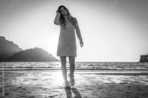 Fotografering Black and white photograph of a young blonde in a Lifestyle session on a beach