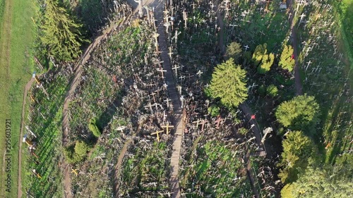 Drone fly down above Lithuanian iconic hill of crosses, aerial view