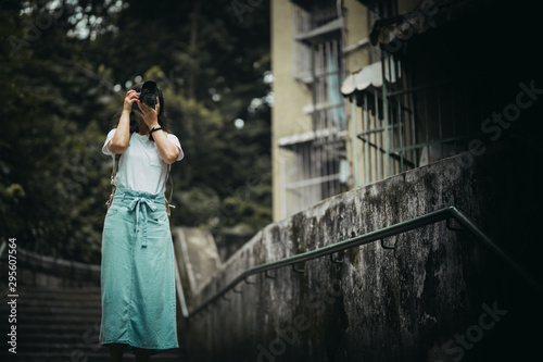 Asian women with camera Traveling in Macau. © YiuCheung