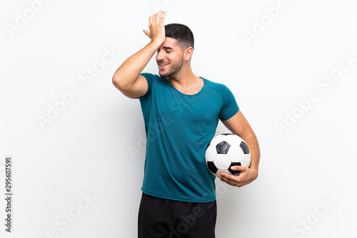 Handsome young football player man over isolated white wall has realized something and intending the solution