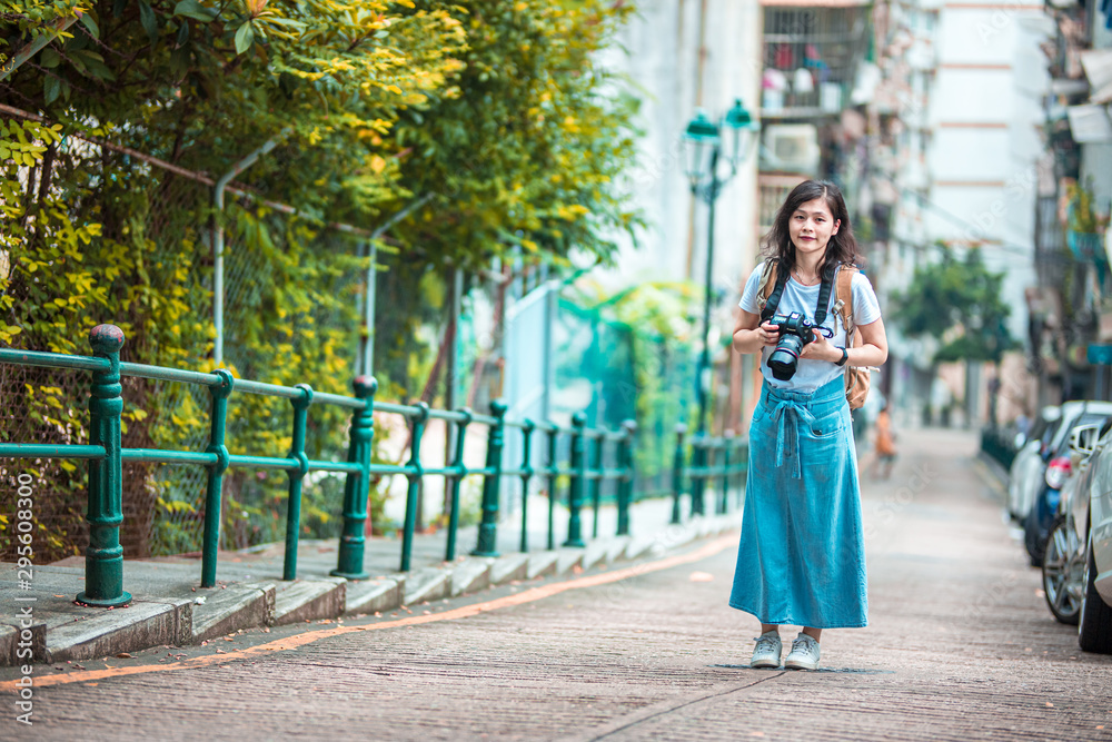 Asian women with camera Traveling in Macau.