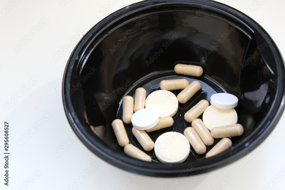 pills and bottle on white background pills and bottle on white background