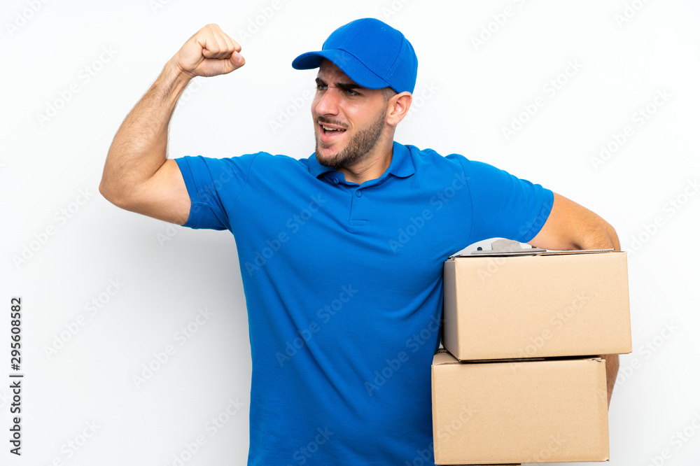 Delivery man over isolated white background celebrating a victory Delivery man over isolated white background celebrating a victory