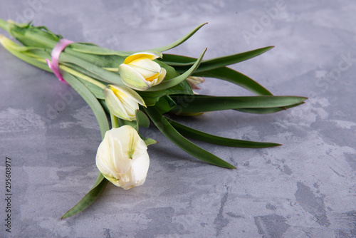 Fototapeta Naklejka Na Ścianę i Meble -  Nice tulip bouquet laying on grey table