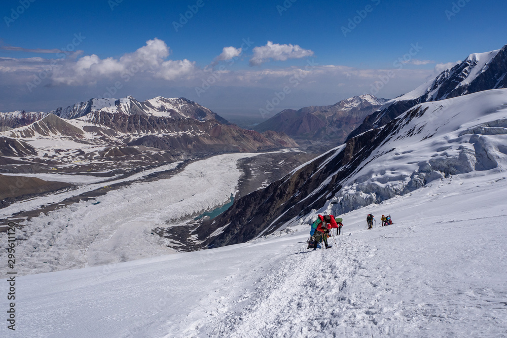 Group of climbers goes to the summit