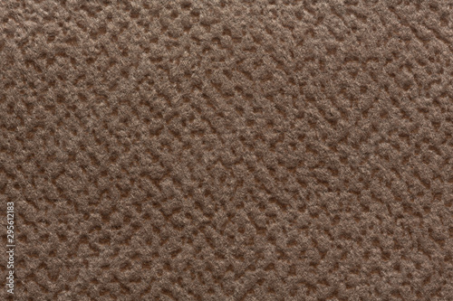 Light brown fabric texture with reliefs.