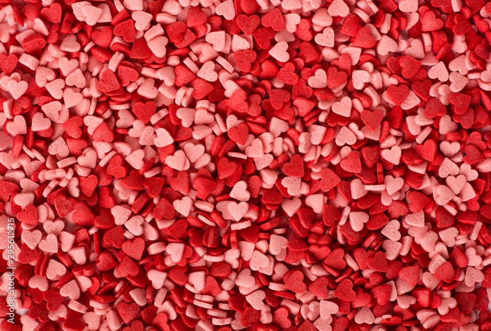 Full frame background of heart shaped sprinkles. Valentines Day background. Full frame background of heart shaped sprinkles. Valentines Day background.